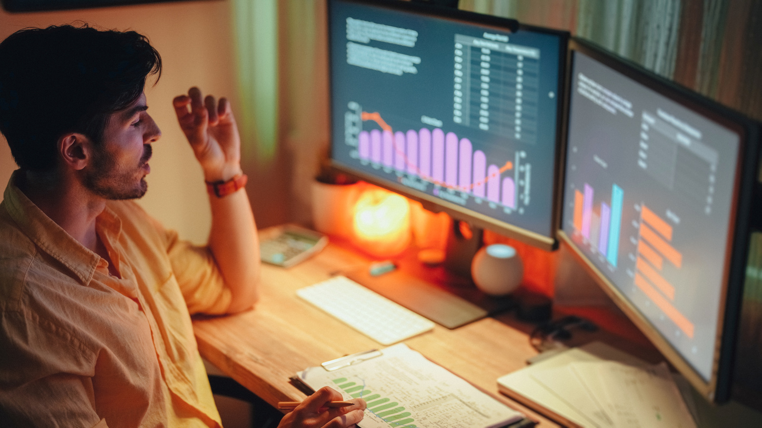 Businessman at home working late is talking to virtual assistant